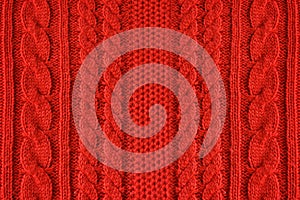 Knitted woolen background, red texture