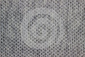 Knitted woolen background. Texture of gray wool close-up. Knitted fabric, handmade