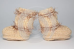 Knitted woolen bootees for young children