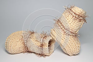 Knitted woolen bootees for young children