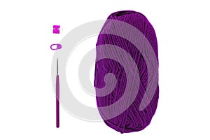 Knitting and crocheting flatlay.Purple yarn skein, crochet hook, row counter on white background isolated. Knit process