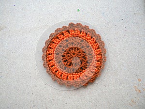 Knitting flower, crochet work on wood background