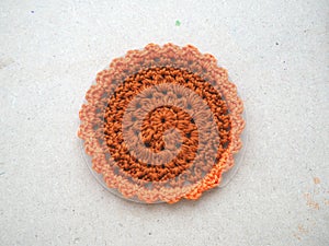 Knitting flower, crochet work on wood background