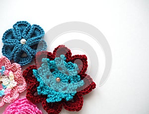 Knitting flower, crochet work on wood background