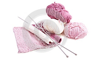 Knitting with pink and white wool
