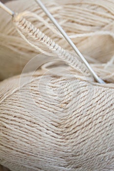 Knitting project in progress. White yarn