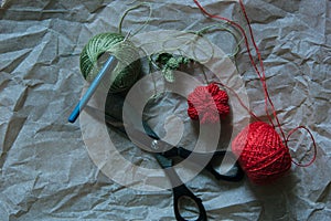 Knitting pumkin with scissors, ball of yarn and crochet hook