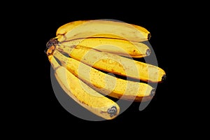 knitting of very ripe bananas on a black background