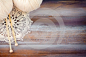 Knitting on wood background