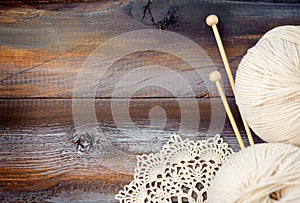 Knitting on wood background