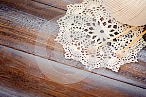 Knitting on wood background