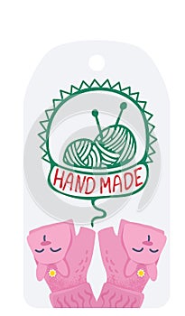 Knitting yarn balls with needles in a labeled ribbon, cute pink gloves. Crafting, DIY projects and creative hobbies