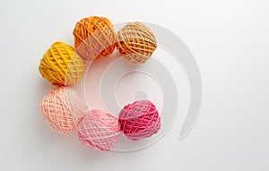 Knitting yarn balls in pink and yellow tone.
