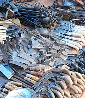 Knives, Axes and Sickles selling at local market photo