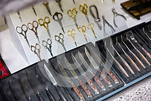 Knives, forks and scissors in showcase