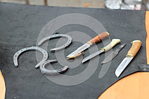 Knives and horseshoes on the table