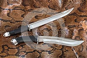 Knives for hunting, defense and assault on python snake skin. Very sharp blades for hunt and defense.