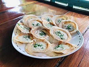 Knmcrk or Kanom Krok or Coconut Crispy Pancake.