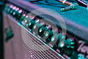 Knobs on Guitar Amplifier closeup, macro photo