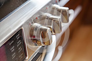 Knobs on a stainless steel stove