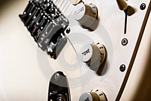 Knobs tone on electric guitar body, music instrument