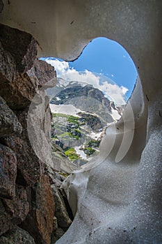 Knobtop mountain framed by snow crevasse