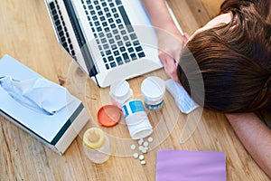 Knocked out by germs. a young woman feeling unwell at home.