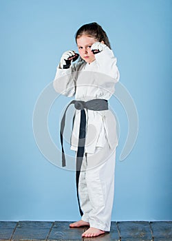 Knockout. energy and activity for kids. small girl in martial arts uniform. practicing Kung Fu. happy childhood. sport