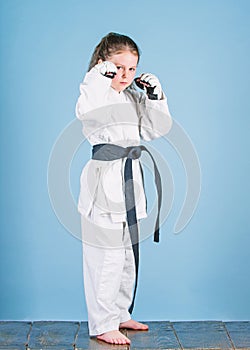 Knockout. energy and activity for kids. small girl in martial arts uniform. practicing Kung Fu. happy childhood. sport