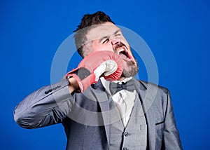 Knockout and energy. Fight. bearded man in boxing gloves punching. businessman in formal suit and tie. Business sport