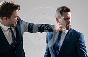 knockout. struggle for leadership. displeased colleague dispute. negotiations. businessmen fighting