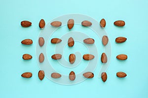 Knolling flat lay almonds on blue
