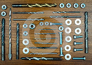 Knolling style photo - various bolts, nuts, drills and washers