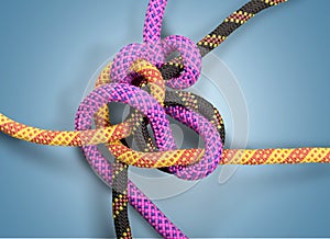 Knot on a colorful cord on light background