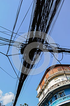 Knot of electric cables on a street of Phnom Penh Cambodia Asia