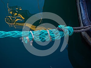 Knots on a tense mooring line. Fastening the ship to the shore. Tight rope