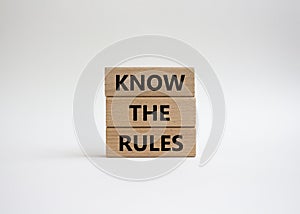 Know the rules symbol. Wooden blocks with words Know the rules. Beautiful white background. Business and Know the rules concept.