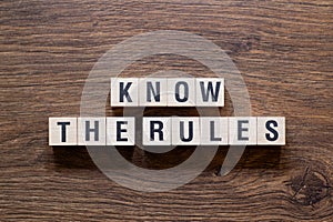 Know the rules - word concept on building blocks, text