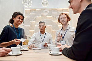 Know your people. Cropped shot of group of businesspeople having coffee, tea during break at business meeting, forum