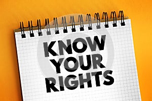 Know Your Rights text on notepad, concept background