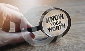 Know Your Worth under Magnifying glass. Self motivation coaching HR concept.