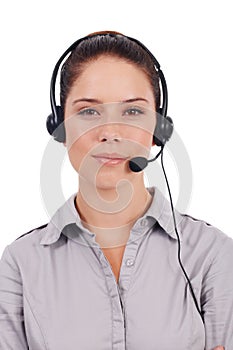 Knowledgable customer support. Portrait of a young customer service representative wearing a headset isolated on white. photo