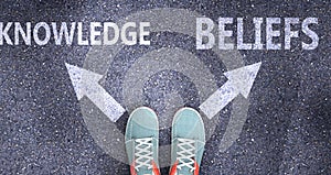 Knowledge and beliefs as different choices in life - pictured as words Knowledge, beliefs on a road to symbolize making decision