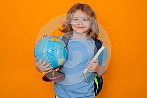 Knowledge day. School pupil with world globe and book. School kid student learning, study geography or literature at