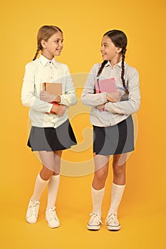 Knowledge day. Schoolgirls best friends excellent pupils. Secondary school. Schoolgirls tidy appearance school uniform