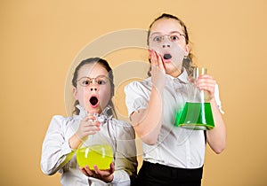 Knowledge day. Schoolgirls friends with chemical liquids. Childhood and upbringing. Knowledge and information