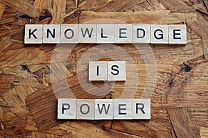 knowledge is power text on wooden square, motivation quotes