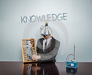 Knowledge text on blackboard with businessman