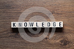 Knowledge - word concept on building blocks, text