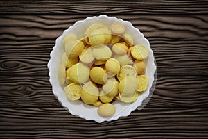 Known as egg biscuits, these Special Kerala Mutta biscuits are also known as Beans biscuits, Coin biscuits, Yellow Biscuits, Baby